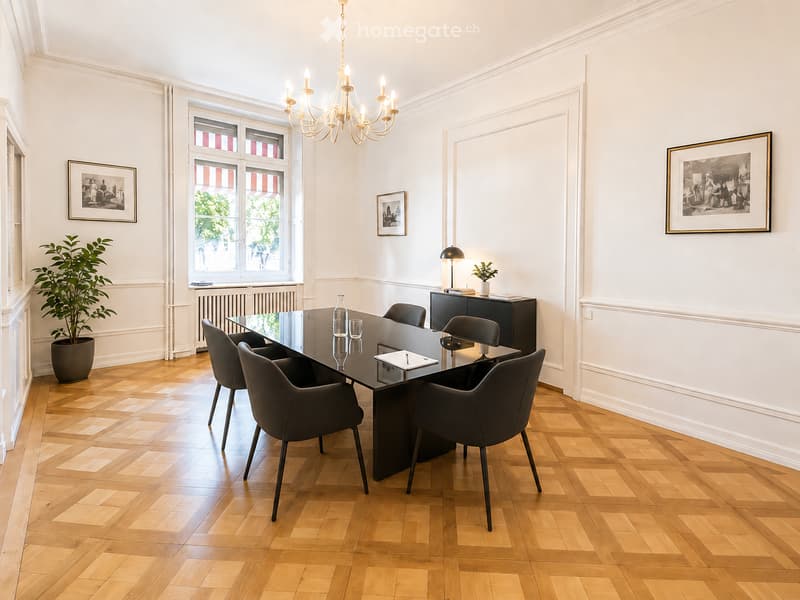 Elegant room with wooden floor, large glass table surrounded by chairs, chandelier, framed artwork, potted plant, and a small cabinet with books and a lamp.