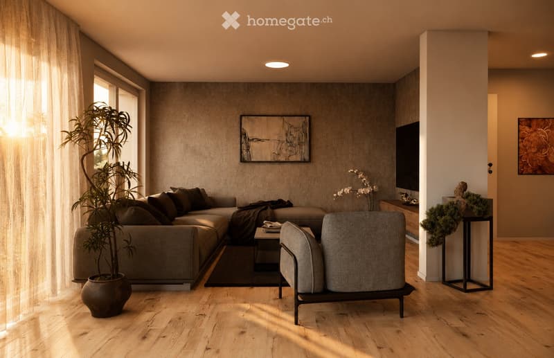 Modern living room with a grey sectional sofa, coffee table, armchair, and large potted plant. The room features wooden flooring, large windows with sheer curtains, and artwork on the walls.