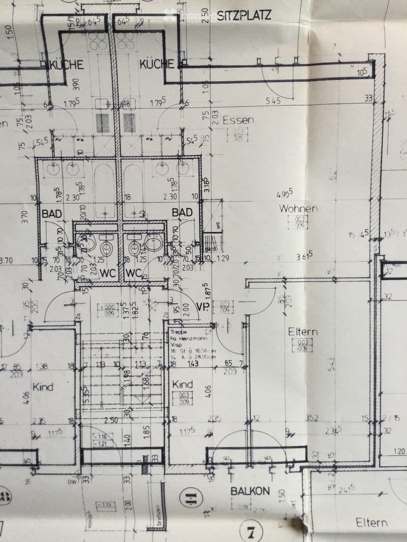 Floor plan showing a kitchen, two bathrooms, two bedrooms, a living/dining area, and a balcony.