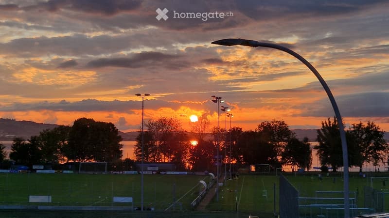 Outdoors with a view of a setting sun