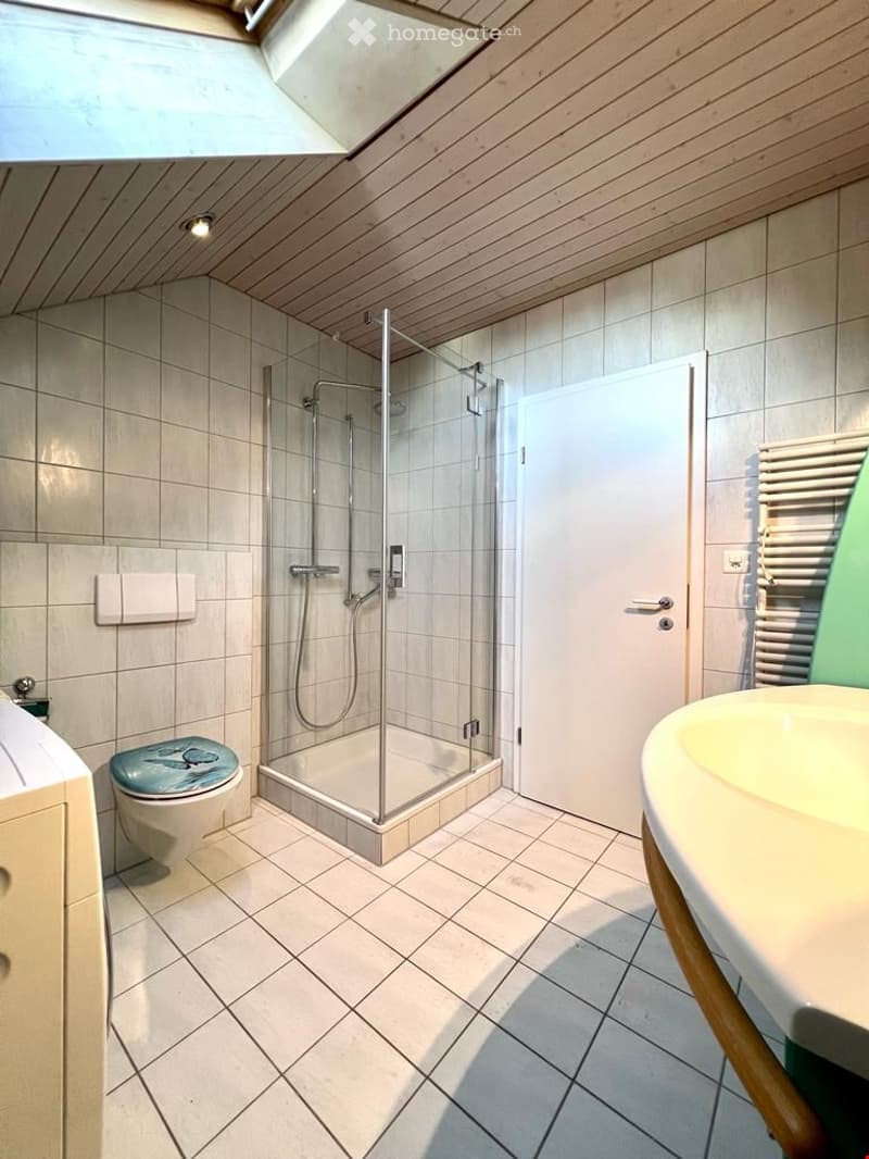 bathroom with shower, toilet, sink, and tile flooring