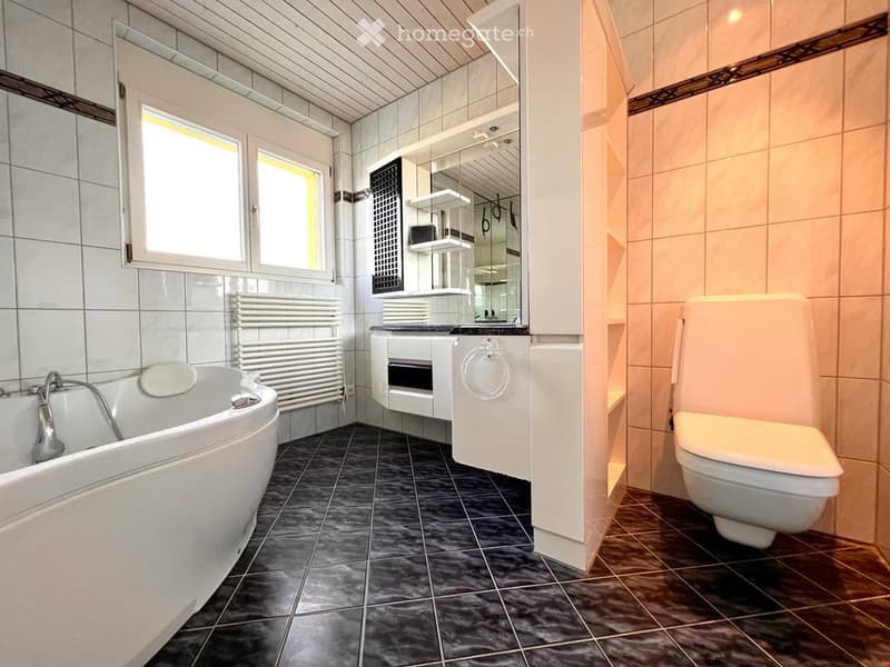 {"visible_features": [],    "type": "Room",    "description": "modern bathroom with a bathtub, toilet, white cabinets, radiator, sink with mirror",    "localized_descriptions":        {        "EN": "modern bathroom with a bathtub, toilet, white cabi