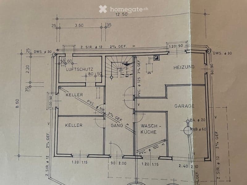 Floor plan of a basement level showing a cellar, airlock, heating room, garage, and wash-kitchen area.