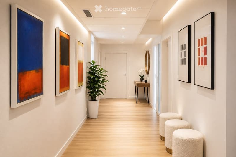 Modern hallway with light wooden flooring, white walls, and several framed artworks. Features a small table with a plant, a mirror, and three white stools near the end.