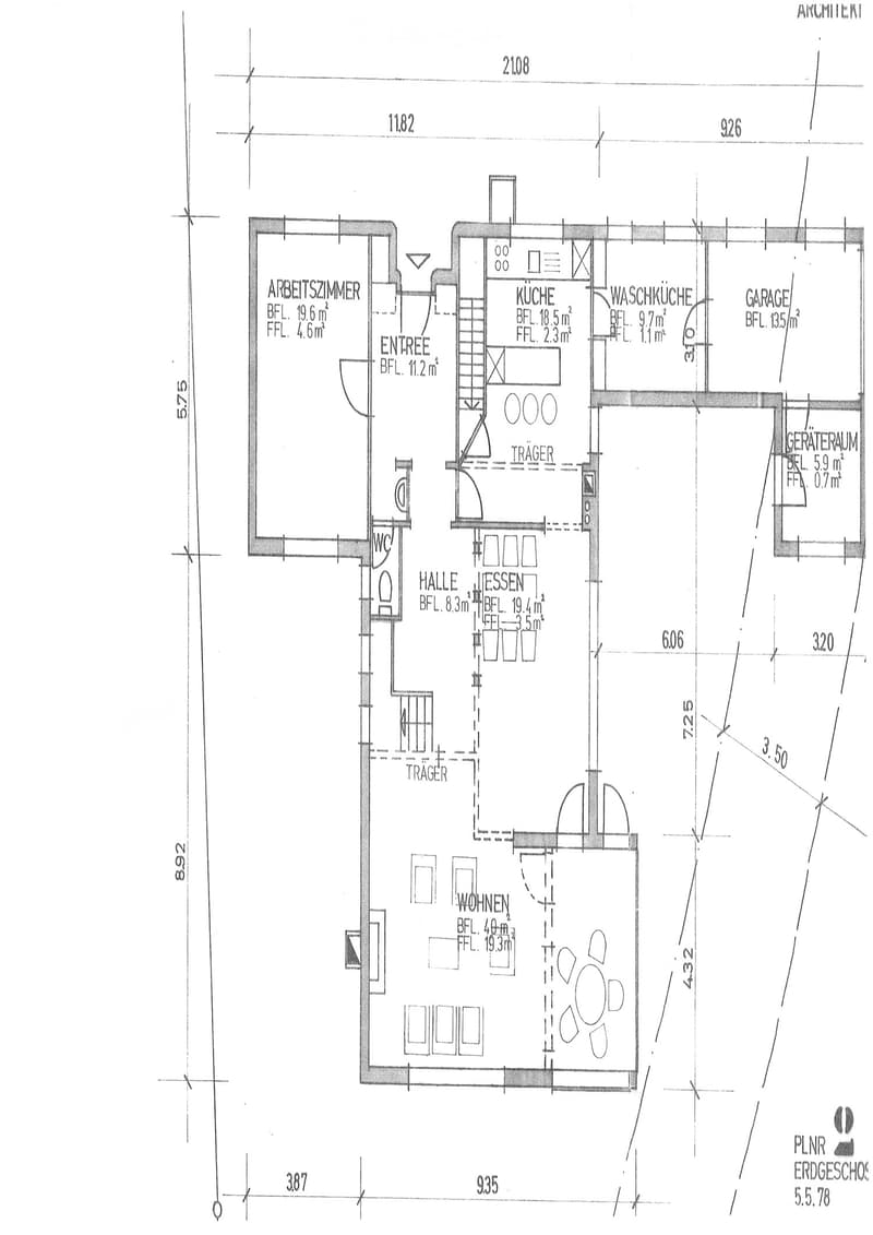 Floor plan of a house with multiple rooms including a kitchen, living area, bedroom, and garage.