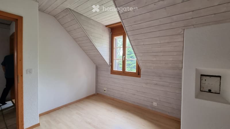 empty room, wooden floor, white walls, wooden window frame, slanted ceiling