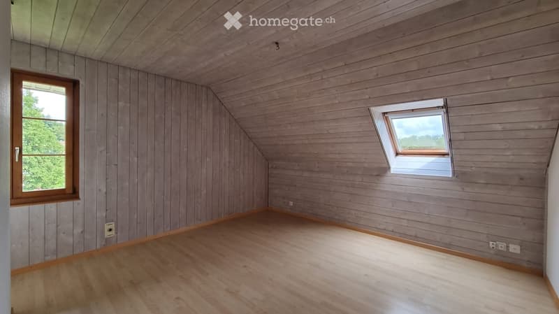 empty room, wooden walls, wooden floor, two windows, power outlets
