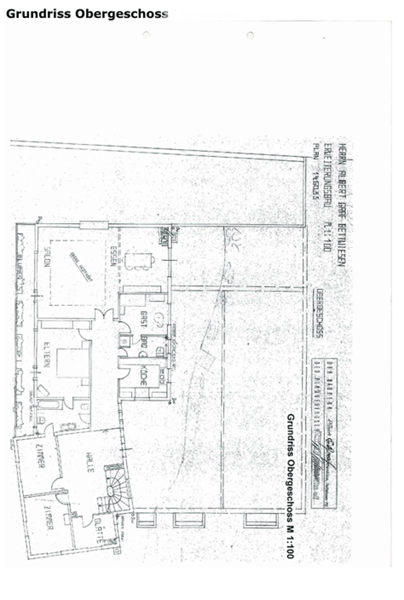 Floor plan of the upper floor showing multiple rooms including a living room, kitchen, bedrooms, and bathrooms.
