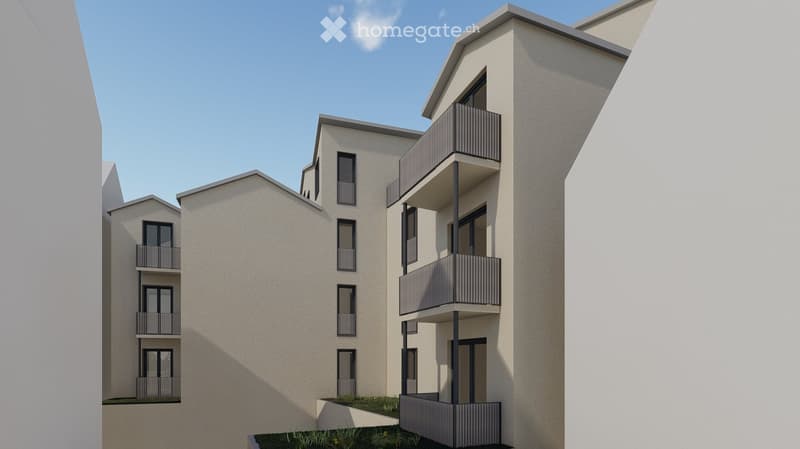 Modern multi-story residential building with balconies and large windows, featuring a clean, contemporary design.