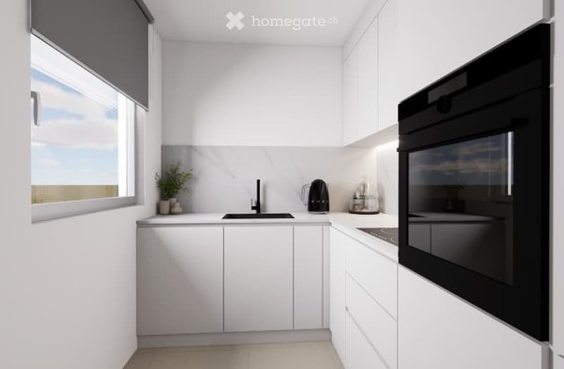 Modern, minimalist kitchen with white cabinets, a black oven, a sink with a faucet, and a small plant on the counter.