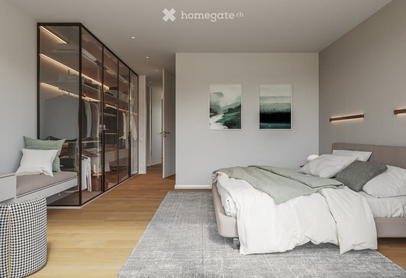 Modern bedroom with a large bed, bench seating, glass wardrobe, and artwork on the walls.