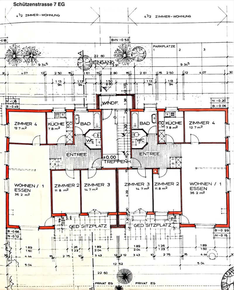Floor plan of a residential unit showing two apartments with separate entrances, each featuring a kitchen, bathroom, and multiple bedrooms.