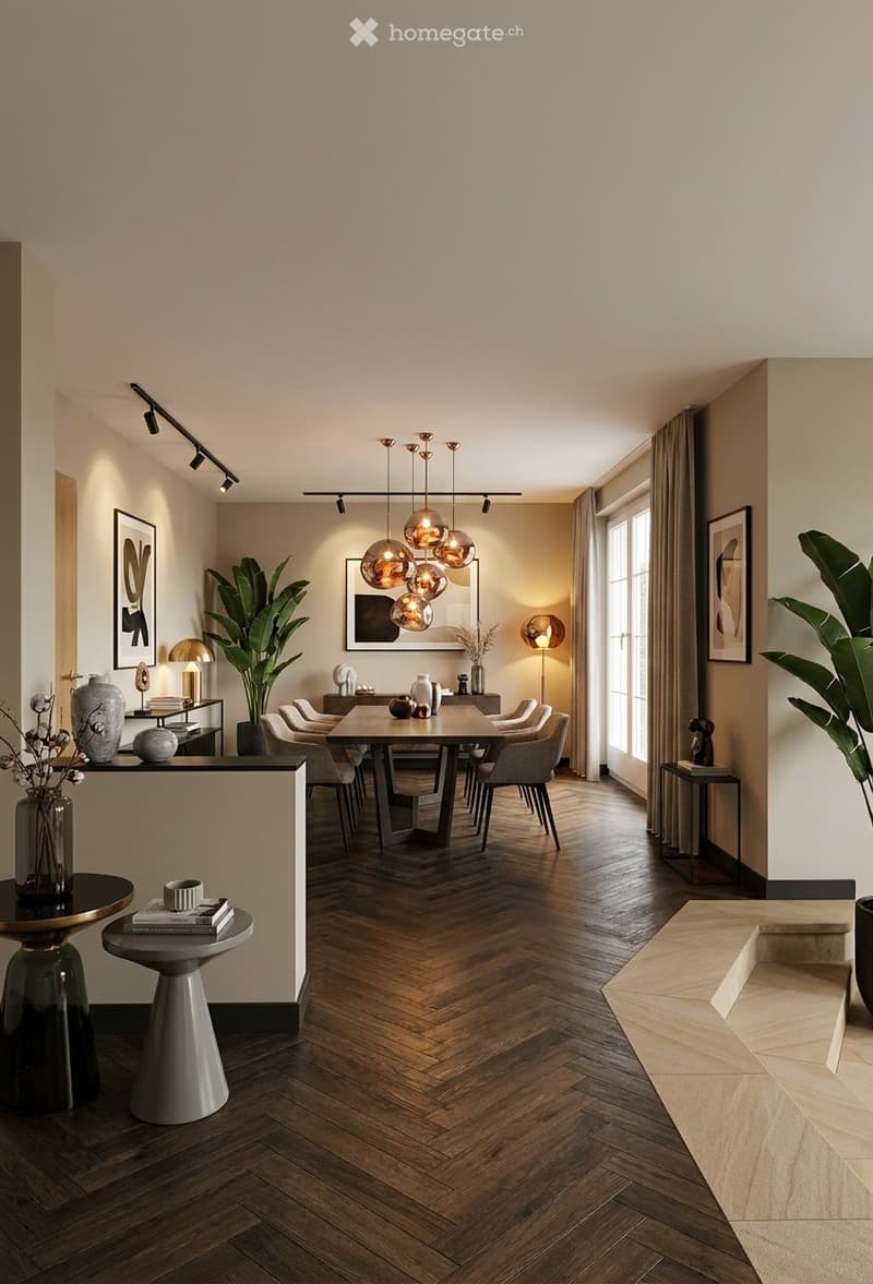 Modern dining area with herringbone wooden flooring, a central dining table surrounded by chairs, decorative vases, books, and a pendant light fixture.