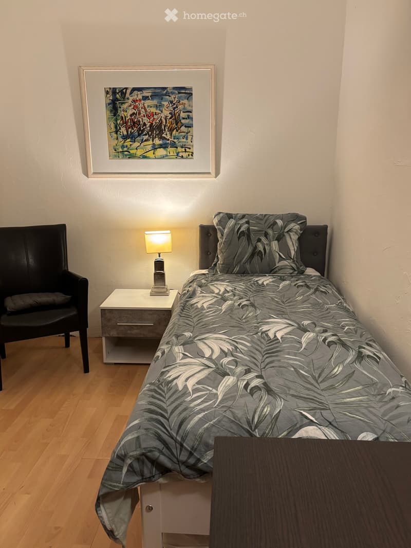 bed, bedside table, chair, painting