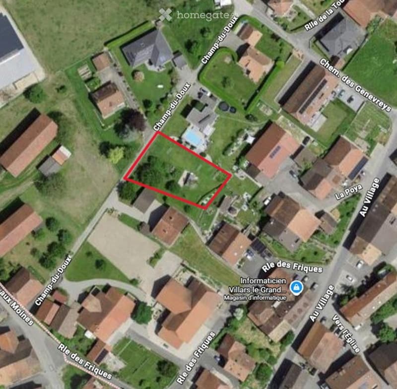 Aerial view of a residential area with houses, streets, and a highlighted plot of land featuring a swimming pool.