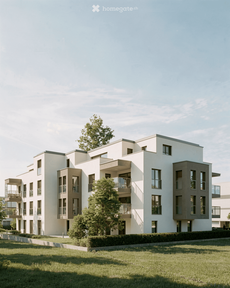 Modern multi-story residential building with white and grey facade, large windows, balconies, and surrounding greenery.