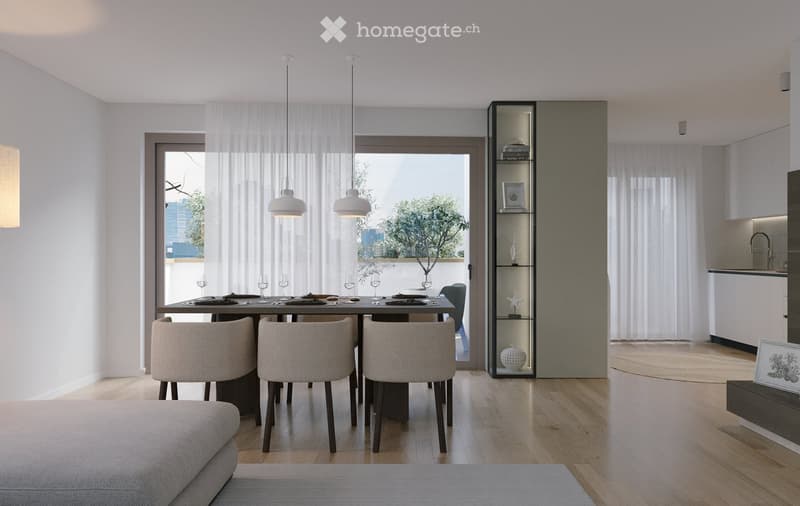Modern dining area with a round table, six chairs, pendant lights, and a view through large windows. Adjacent kitchen area with white cabinets and a sink.