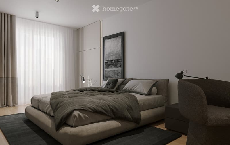 Modern bedroom with a large bed, grey bedding, a sofa, nightstand, lamp, and a large picture frame on the wall. The room features large windows with sheer curtains and a sleek, contemporary design.