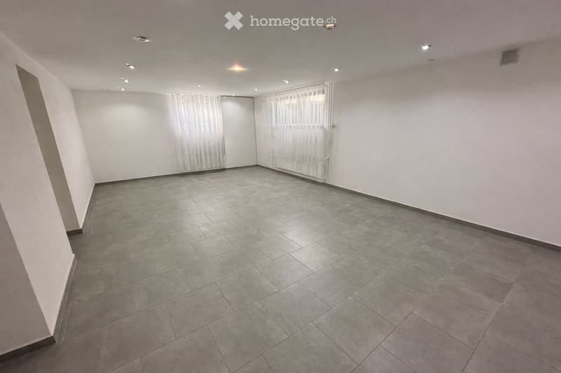spacious room, gray tiles, white walls, white curtains, window, recessed lighting