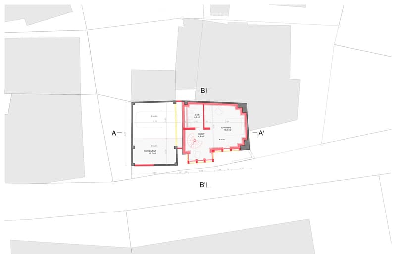 Floor plan of a residential space showing a kitchen, dining area, living room, and bedroom. Includes labeled areas and dimensions.