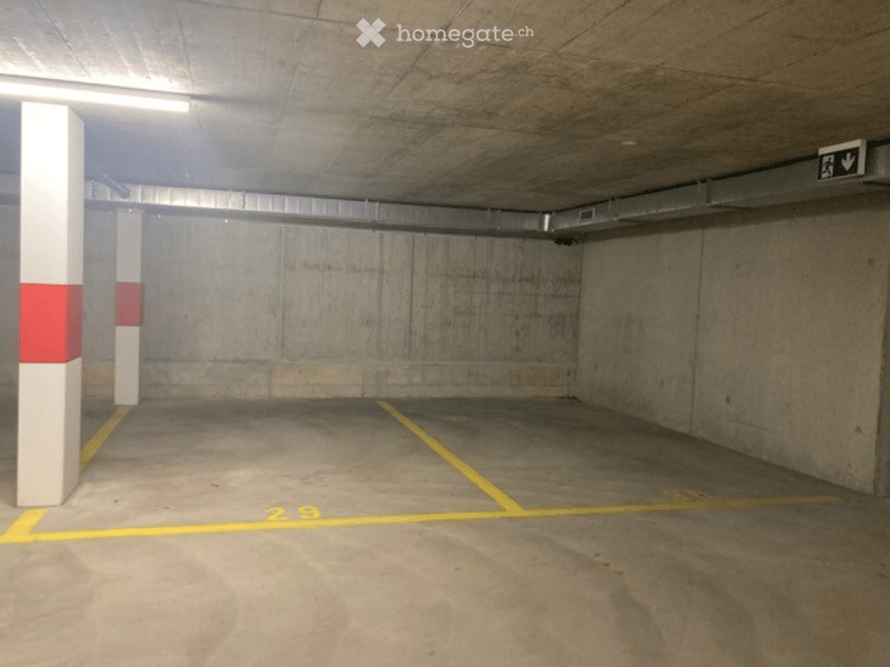 {"visible_features": ["Garage"], "type": "Garage", "objects": [], "description": "Empty underground parking garage with concrete pillars, marked parking spaces, and a single emergency exit sign.", "localized_descriptions": {"EN": "Empty underground parkin