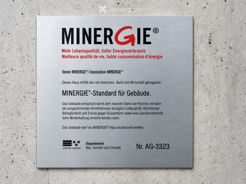 Certificate for a MINERGIE-standard building, featuring text in German and French, with logos and a reference number.