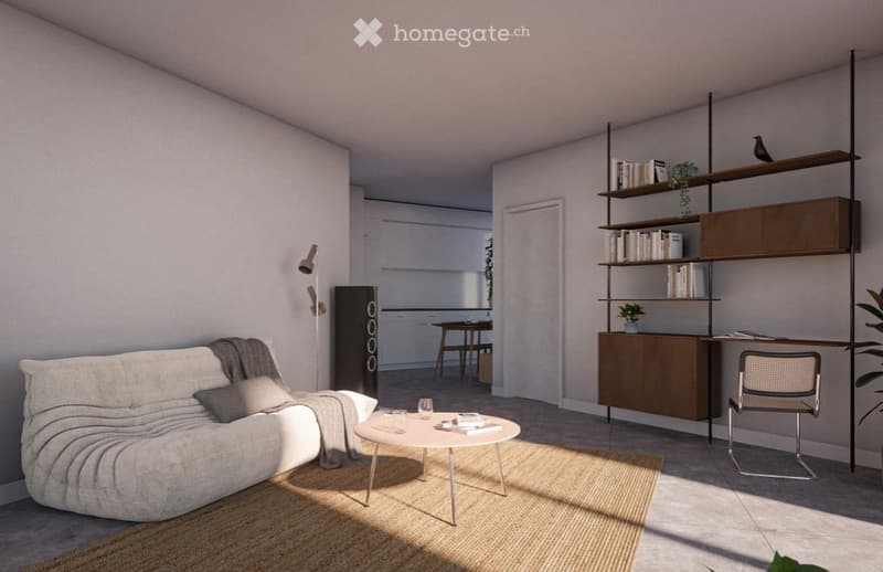 Modern living room with a white sofa, coffee table, bookshelf, and a small dining area visible in the background.