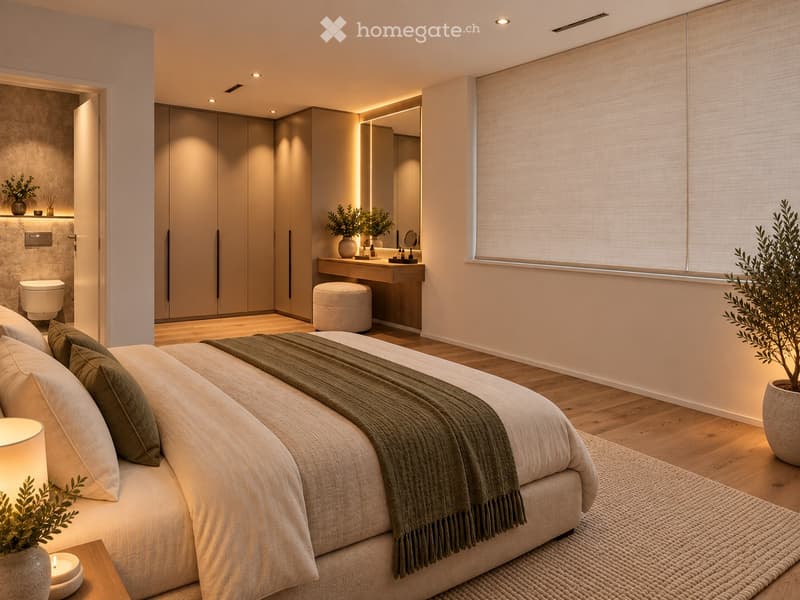 Modern bedroom with a large bed, pillows, blanket, side table with lamp, and a small plant. Adjacent bathroom features a vanity, mirror, stool, and wardrobe.