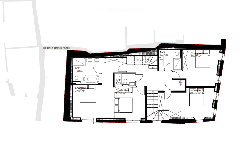 Floor plan of a building with multiple rooms including bedrooms, bathrooms, and an annex building projection.