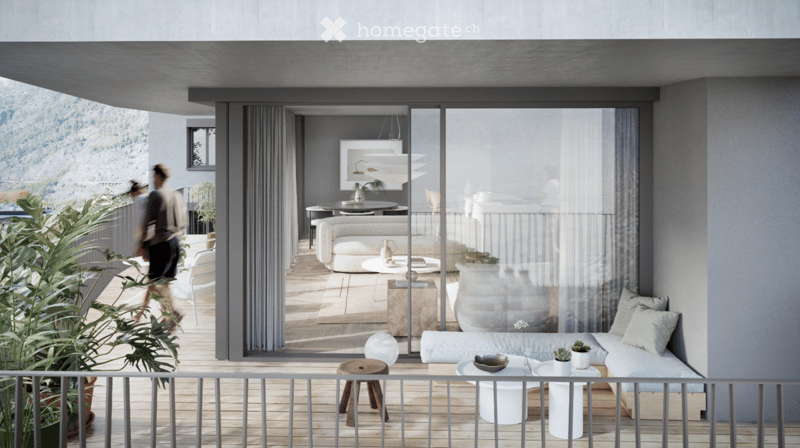 Modern balcony with wooden flooring, white sofa, small table, and potted plants, overlooking a scenic mountain view.