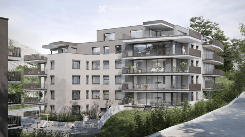 Modern multi-story residential building with balconies, large windows, and contemporary design, surrounded by greenery and a pathway.