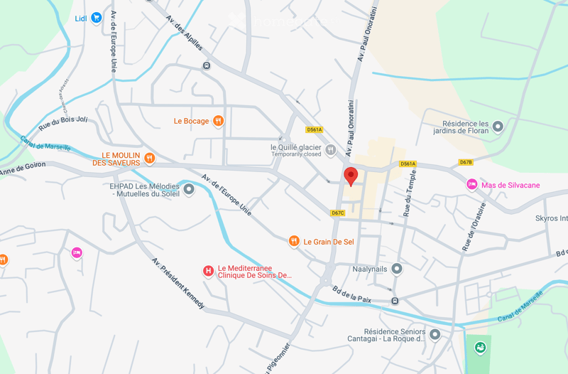 A map of an area with various buildings and landmarks, one building is highlighted with a pin indicating an address.