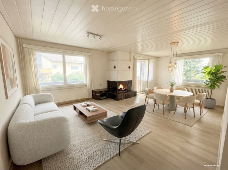 Modern living room with a fireplace, large windows, a grey sofa, coffee table, dining area with a round table and chairs, and a potted plant.