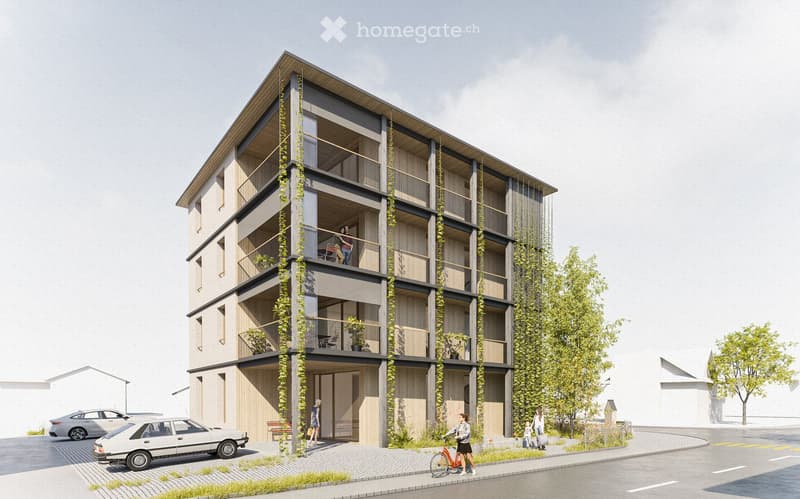Modern multi-story building with balconies, greenery, and a contemporary design. The structure features a combination of wood and concrete, with large windows and a sloped roof. There are several balconies adorned with plants and furniture, and a few peop
