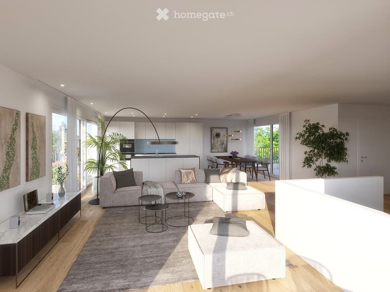 Modern living room with a grey sectional sofa, coffee table, ottoman, dining area, and kitchen area. Features include large windows, wooden flooring, and decorative plants.