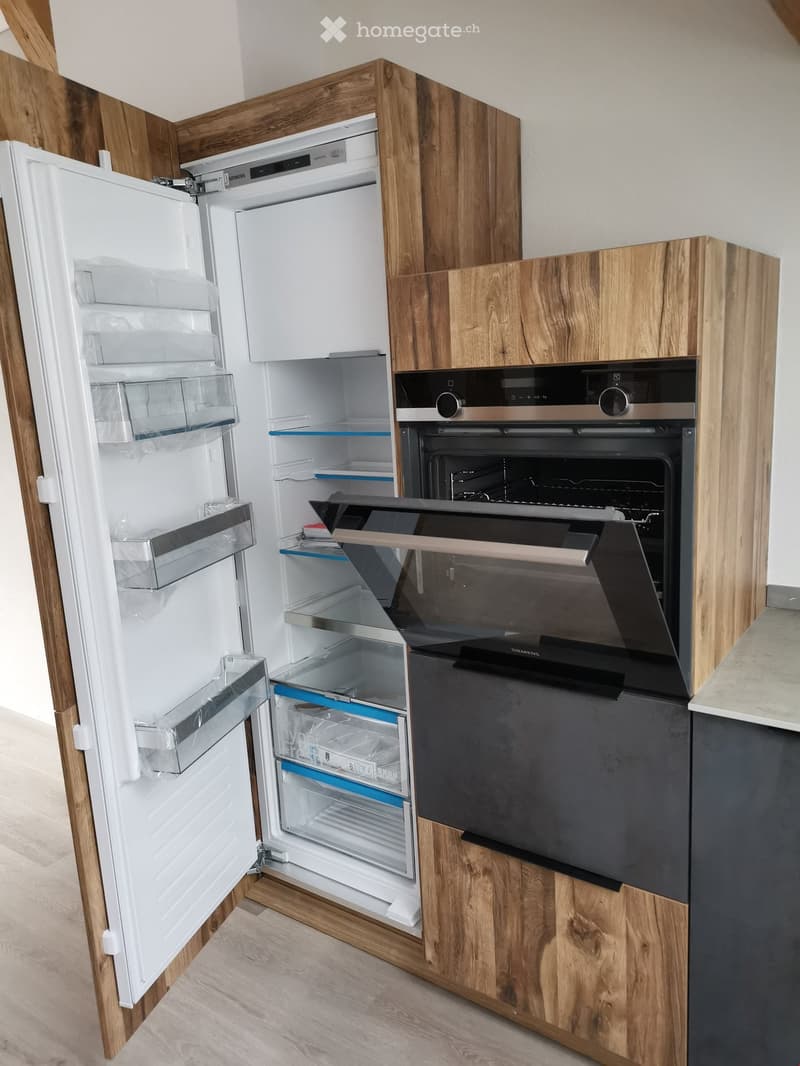 Open refrigerator and oven, modern kitchen, wooden cupboards