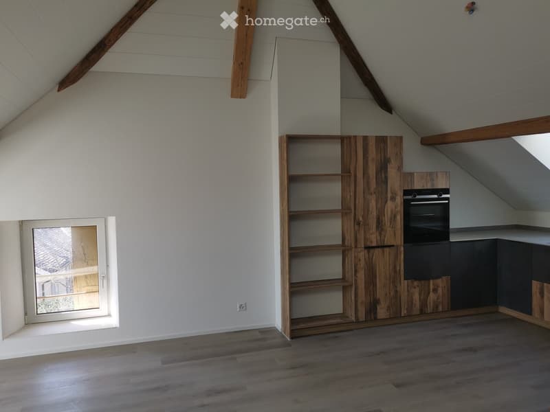 empty attic room, wooden beams, wooden shelf, built-in oven, window