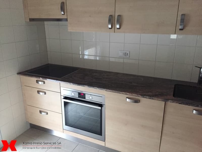 Spacieux appartement de 5.5 pièces avec balcon au 1er étage (1)