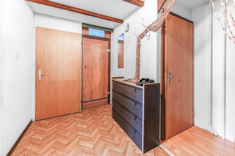 wooden doors, wooden floor, large dresser, mirror