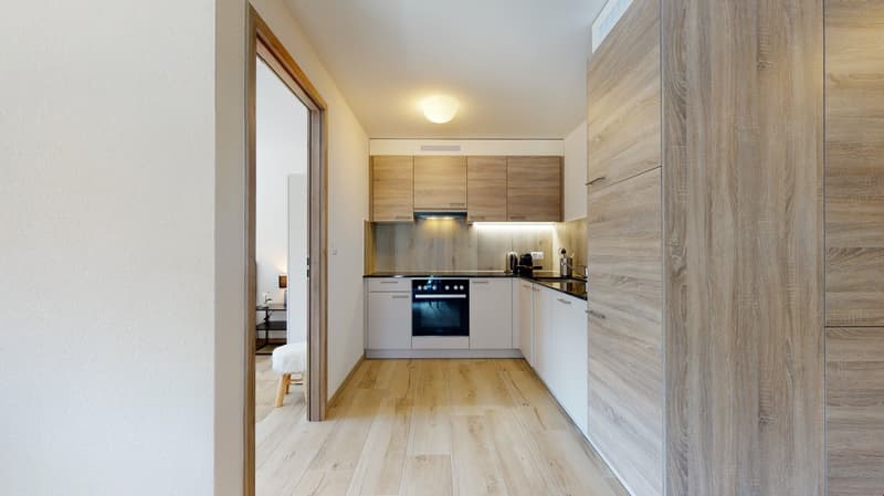 Wooden floor, wooden kitchen cabinets, white appliances, modern kitchen design