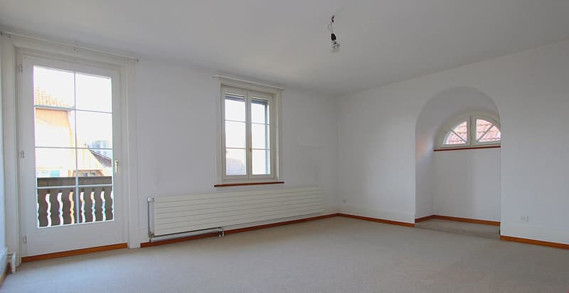 empty room, white walls, white ceiling, white floor, two windows, balcony