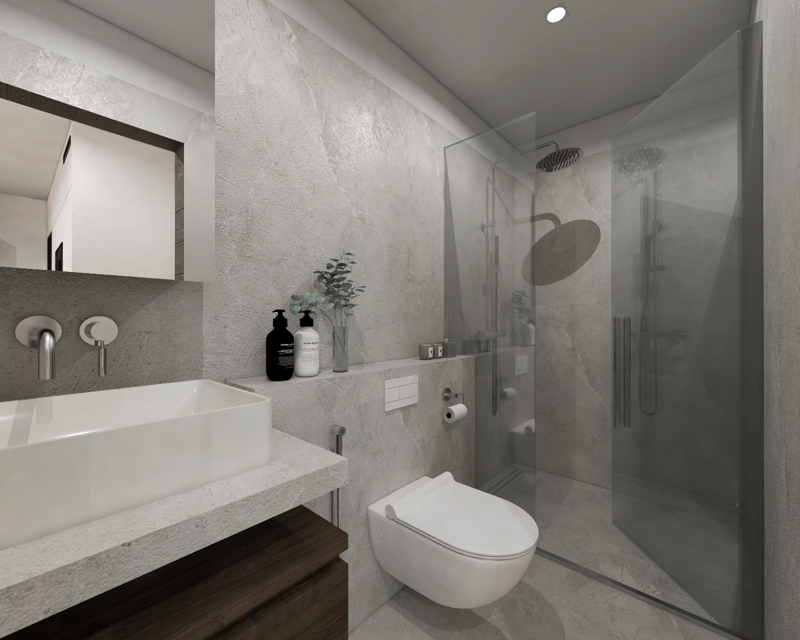 Modern bathroom with gray marble-like walls, white sink, toilet, and glass shower enclosure. Shelves with toiletries and decor items are visible.