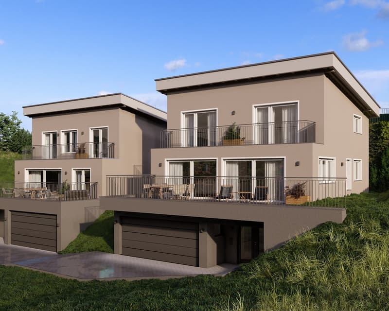 Two-story modern residential building with a beige exterior, balconies, and garages on the ground level. The building has a sleek, contemporary design with large windows and a flat roof.