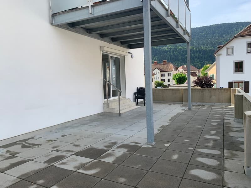 White painted walls, gray tile floor, balcony, stairs, railings