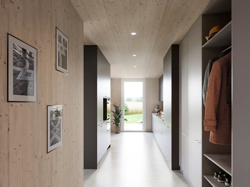 wooden wall, white floor, white cabinets, potted plant, framed pictures, open door, light