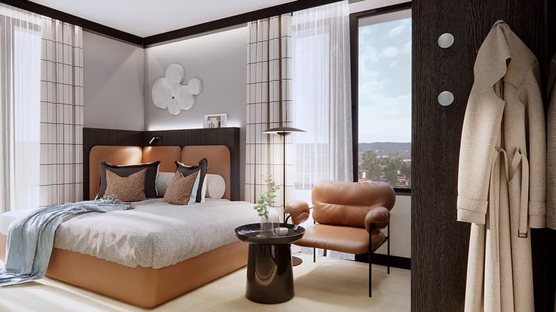 Modern bedroom with double bed, orange headboard, nightstand, lamp, armchair, and window with curtain