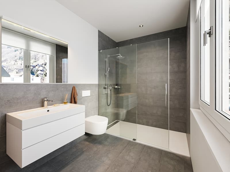 White cabinet, white countertop, toilet, shower cubicle, wall-mounted lights, gray walls, white flooring, mirror with reflection
