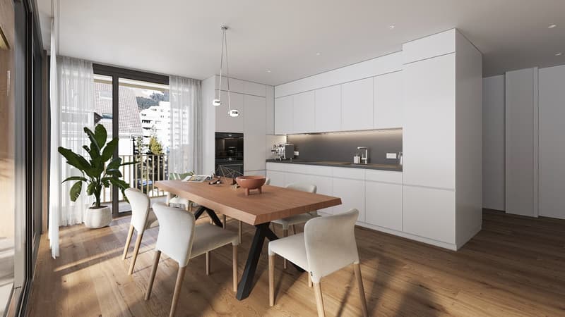 Dining room with white chairs, wooden table, white kitchen cabinets, potted plant, glass door leading to balcony with view.