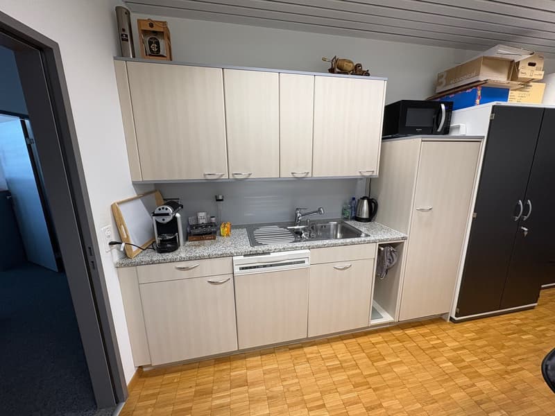 kitchen with wooden floor, granite countertop, sink, dishwasher, microwave, coffee machine, cabinets, refrigerator