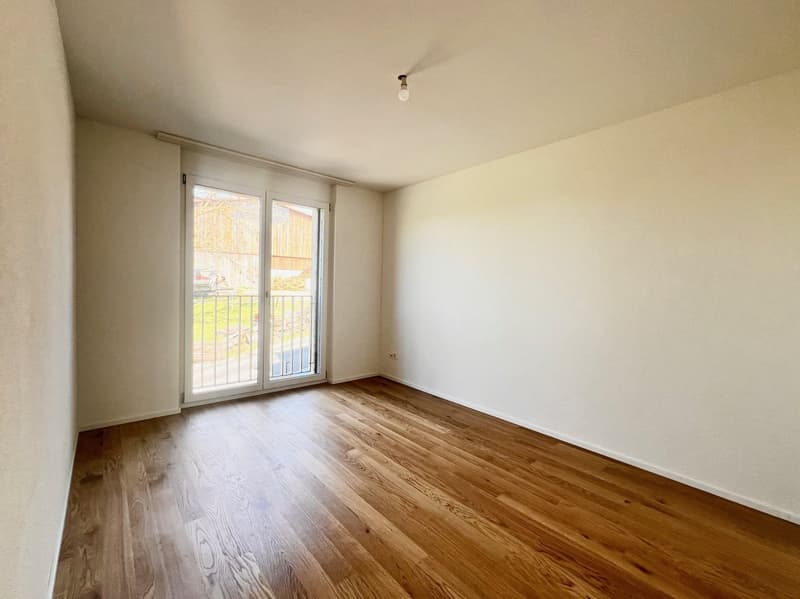 empty room, wooden floor, white walls, sliding glass door, balcony